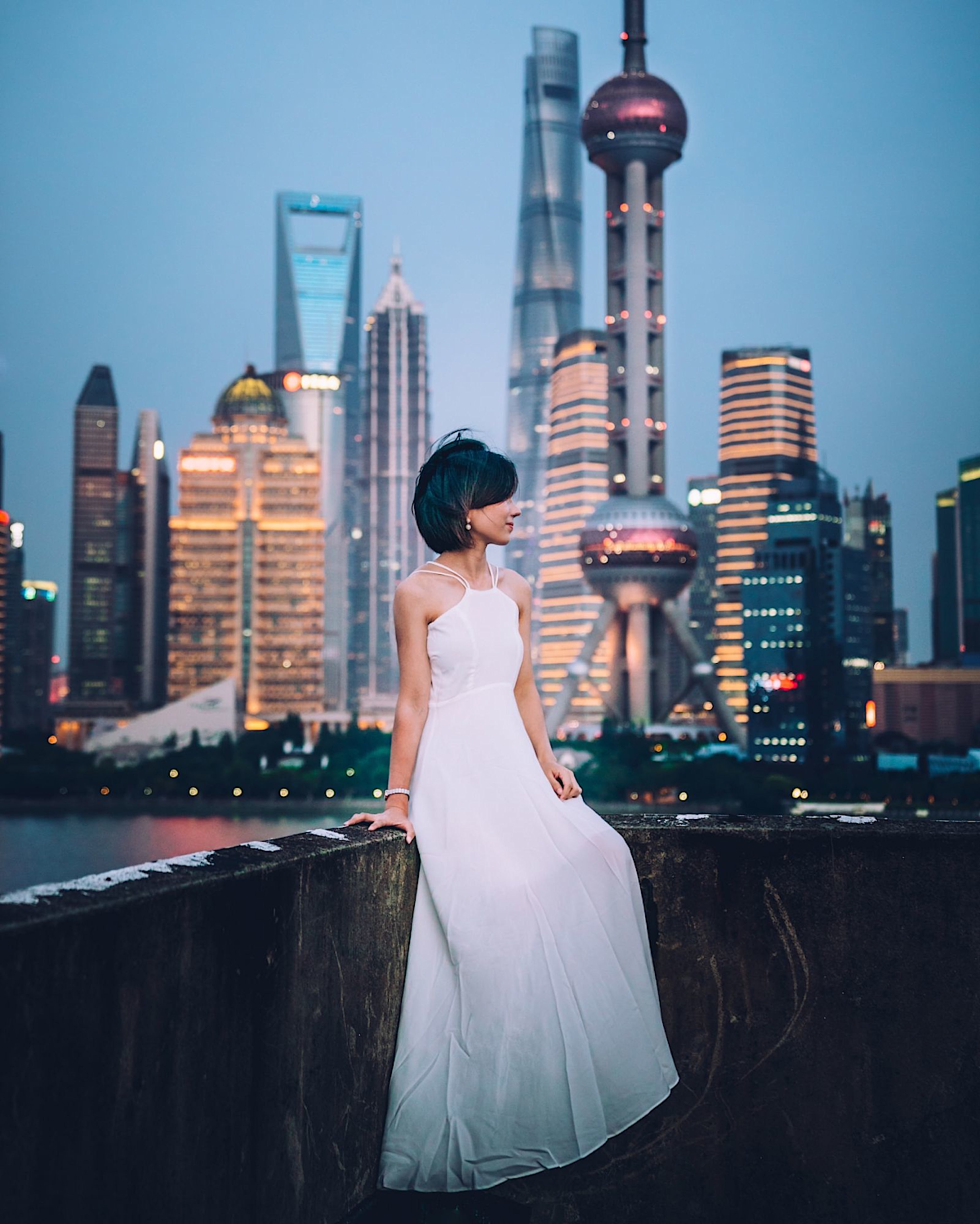 woman enjoying view of skyline in shanghai