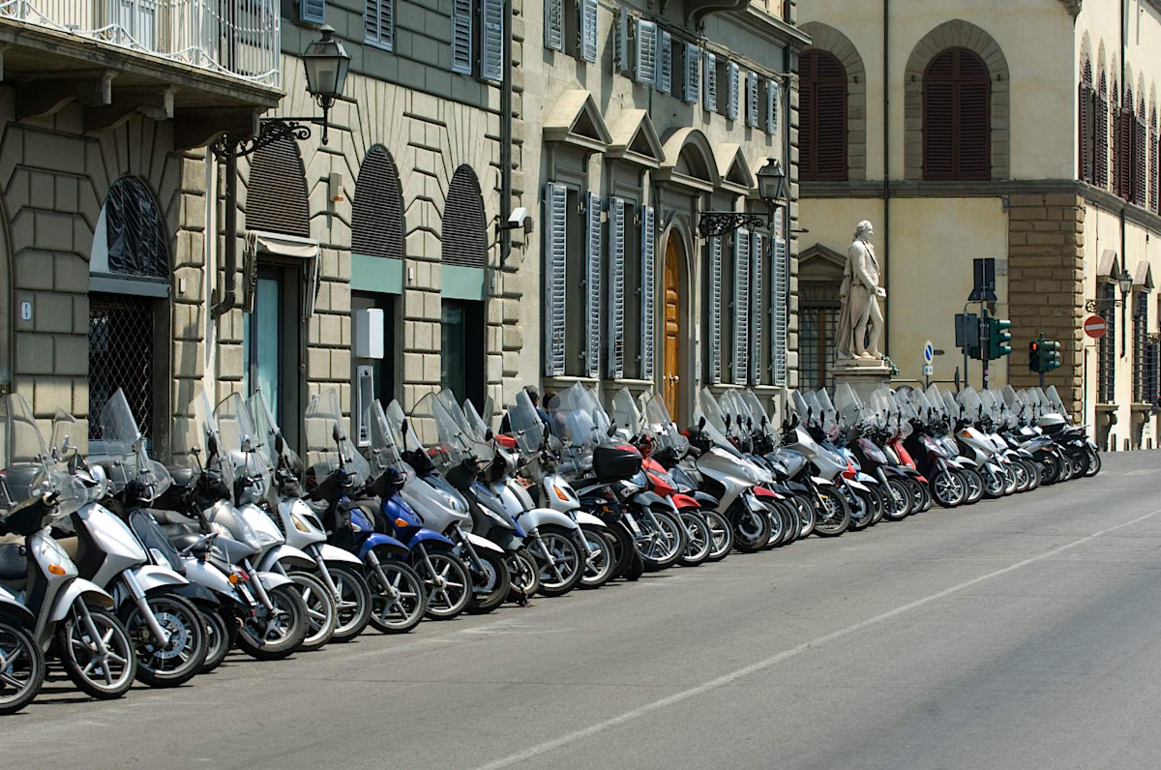 Row Of Vespas On Street In Florence