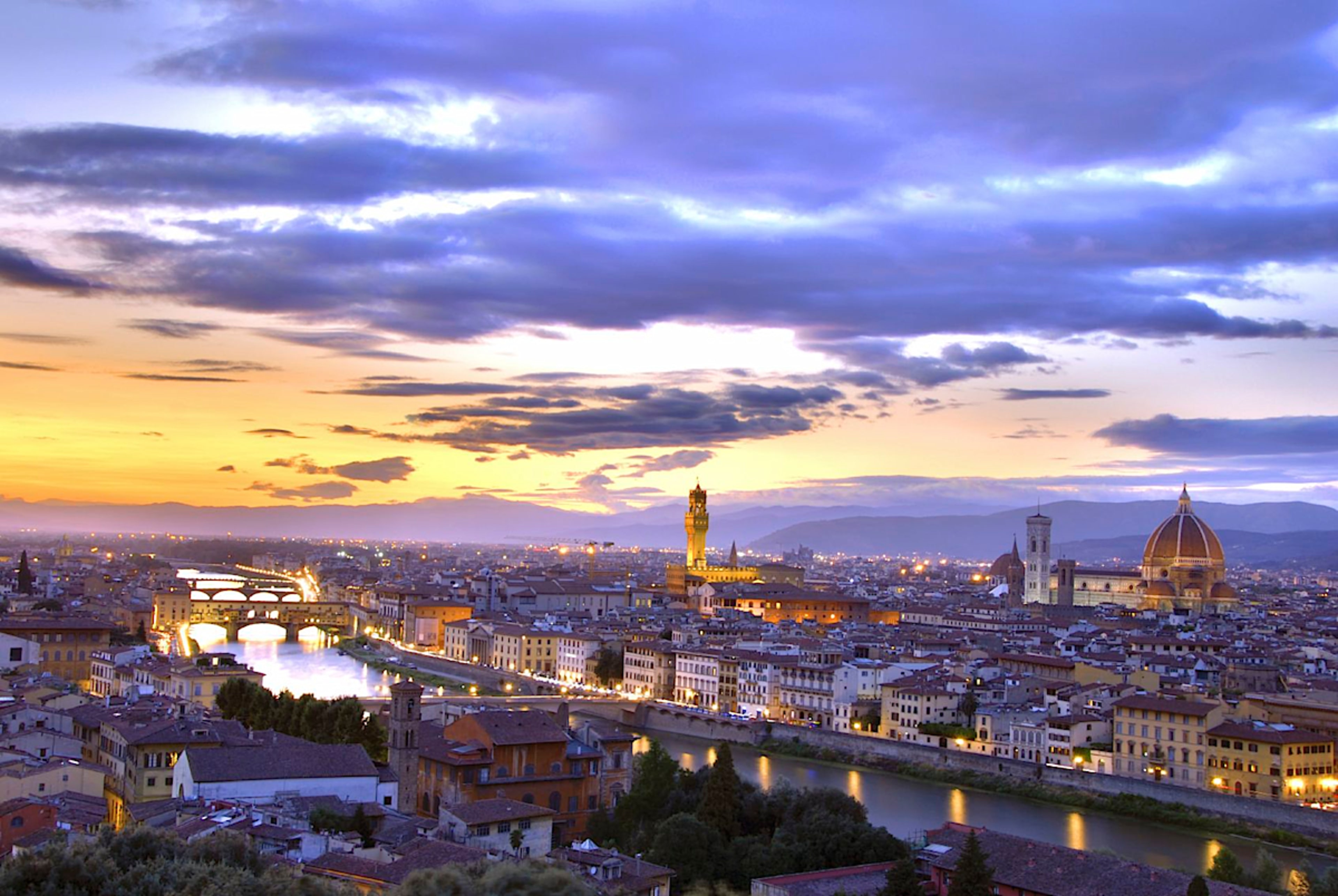Sunset Over Arno River And Florence Cityscape