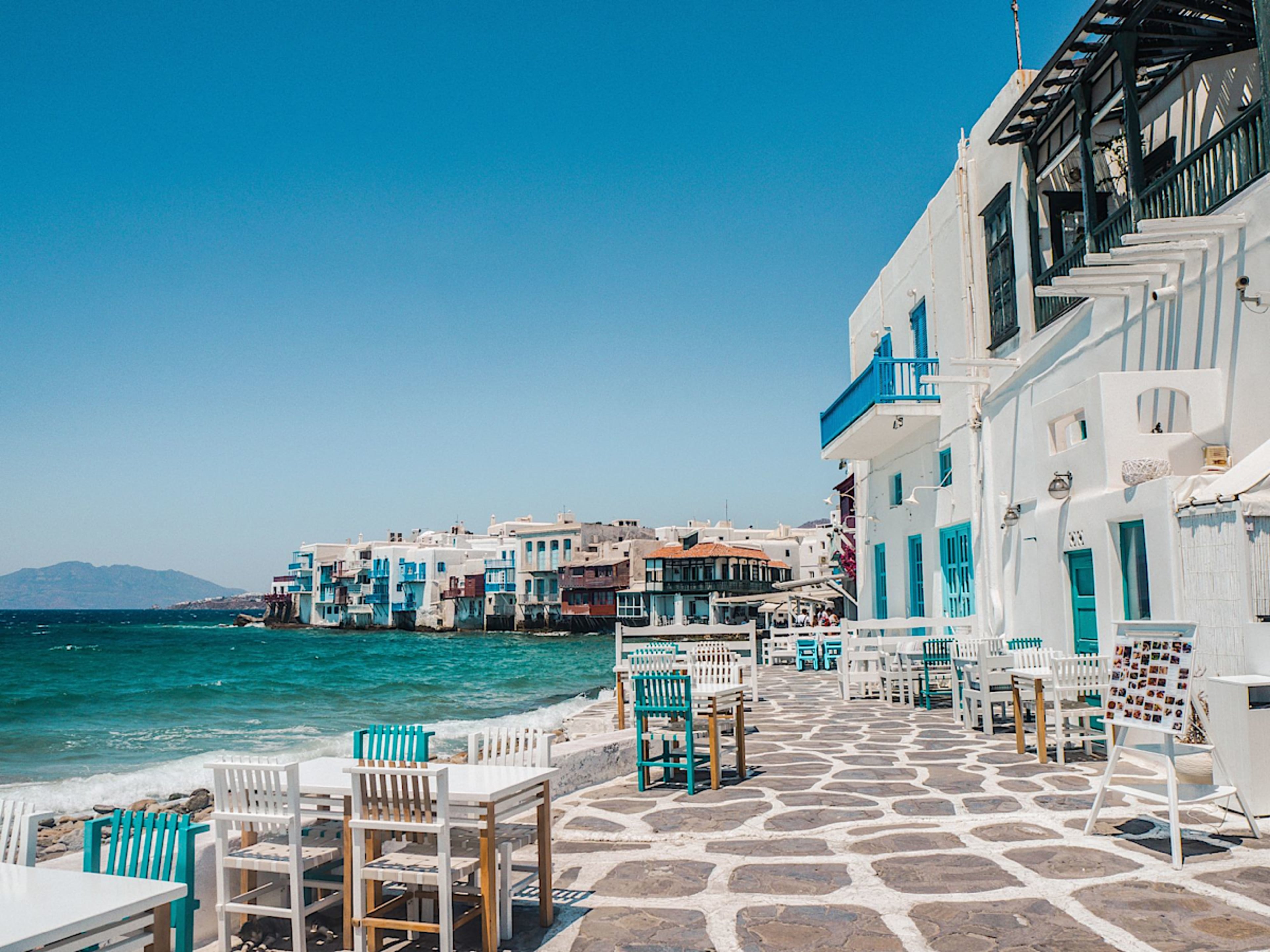 Golden Beaches and Iconic Blue-and-White Houses